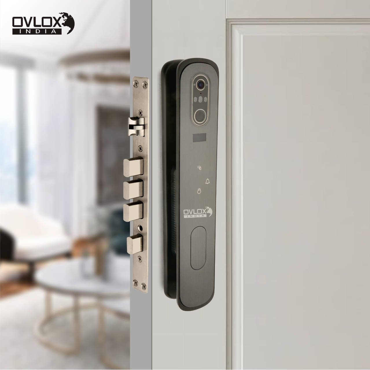 An Ovlox India face-recognition lock with camera and fingerprint reader on a home door.